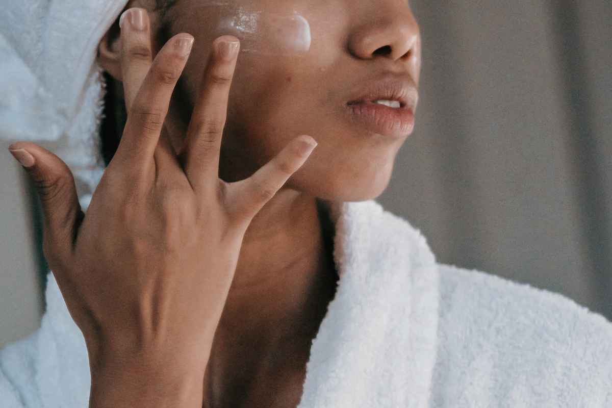 A woman takes care of the sensitive skin on her face by using our array of all natural, allergen free skincare products. 